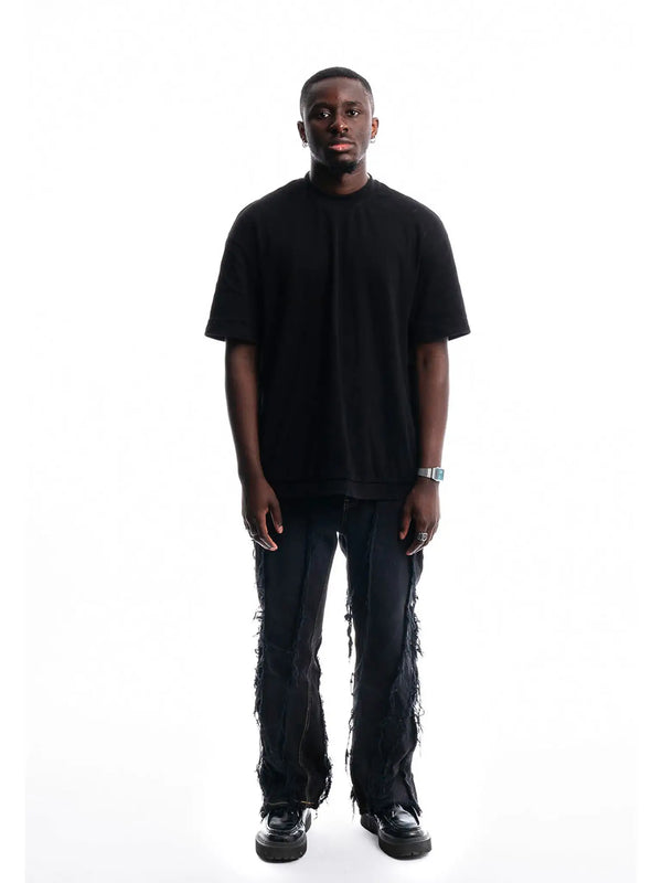 Black Ripped Denim — front view of 1/1 upcycled jeans handmade in Paris