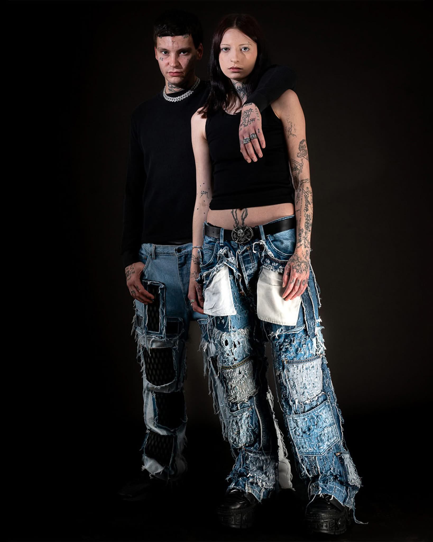 Models wearing Reptilian 3D Printed Denim and Cobalt Shredded Denim by PrototypesParis, featuring printed textures and shr...