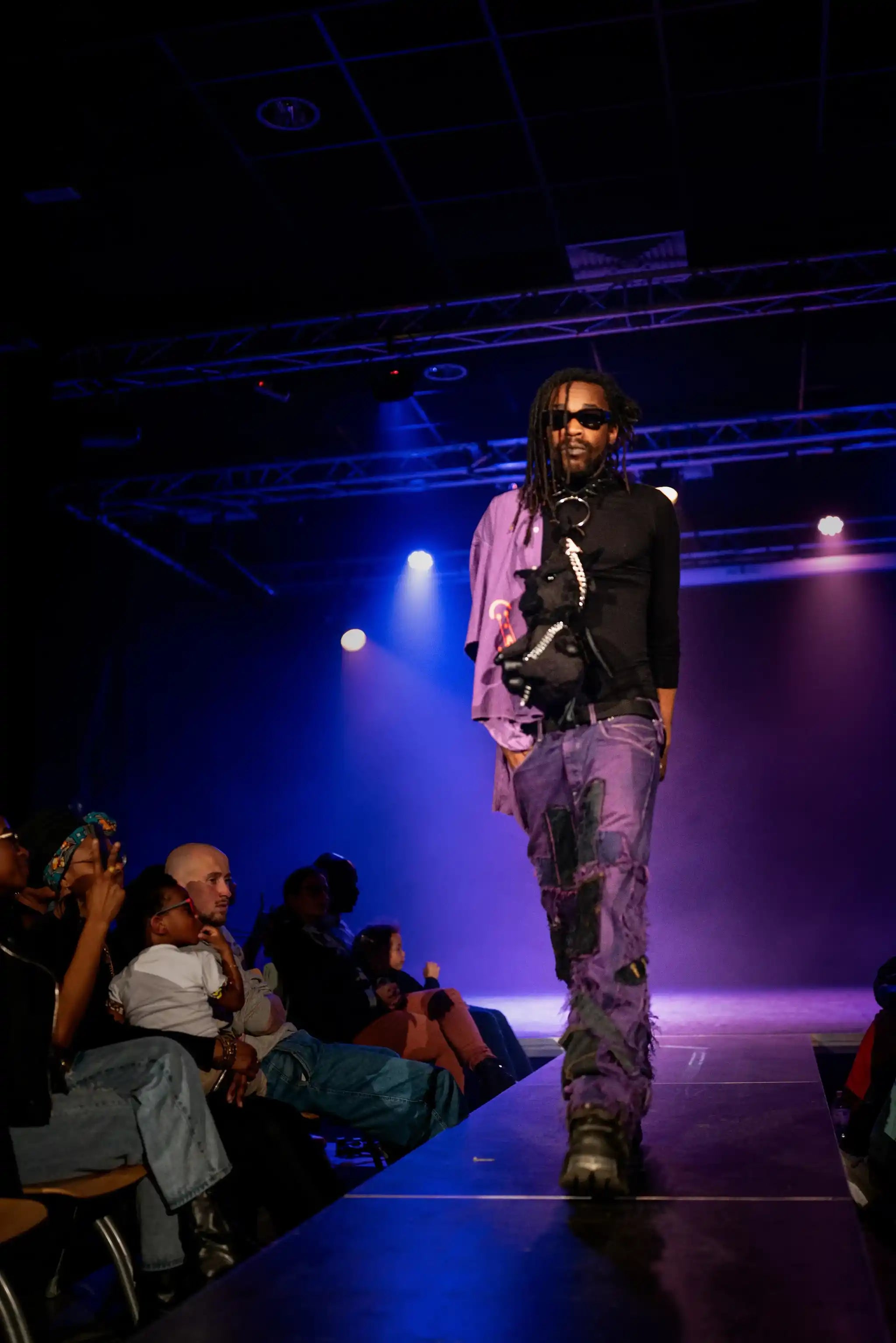 PrototypesParis fashion show: purple denim with shirt — upcycled panels and raw hems, front view.