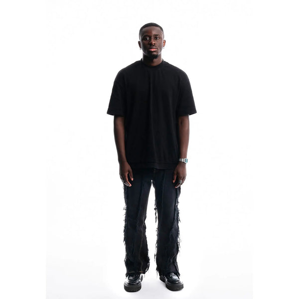 Black Ripped Denim — front view of 1/1 upcycled jeans handmade in Paris