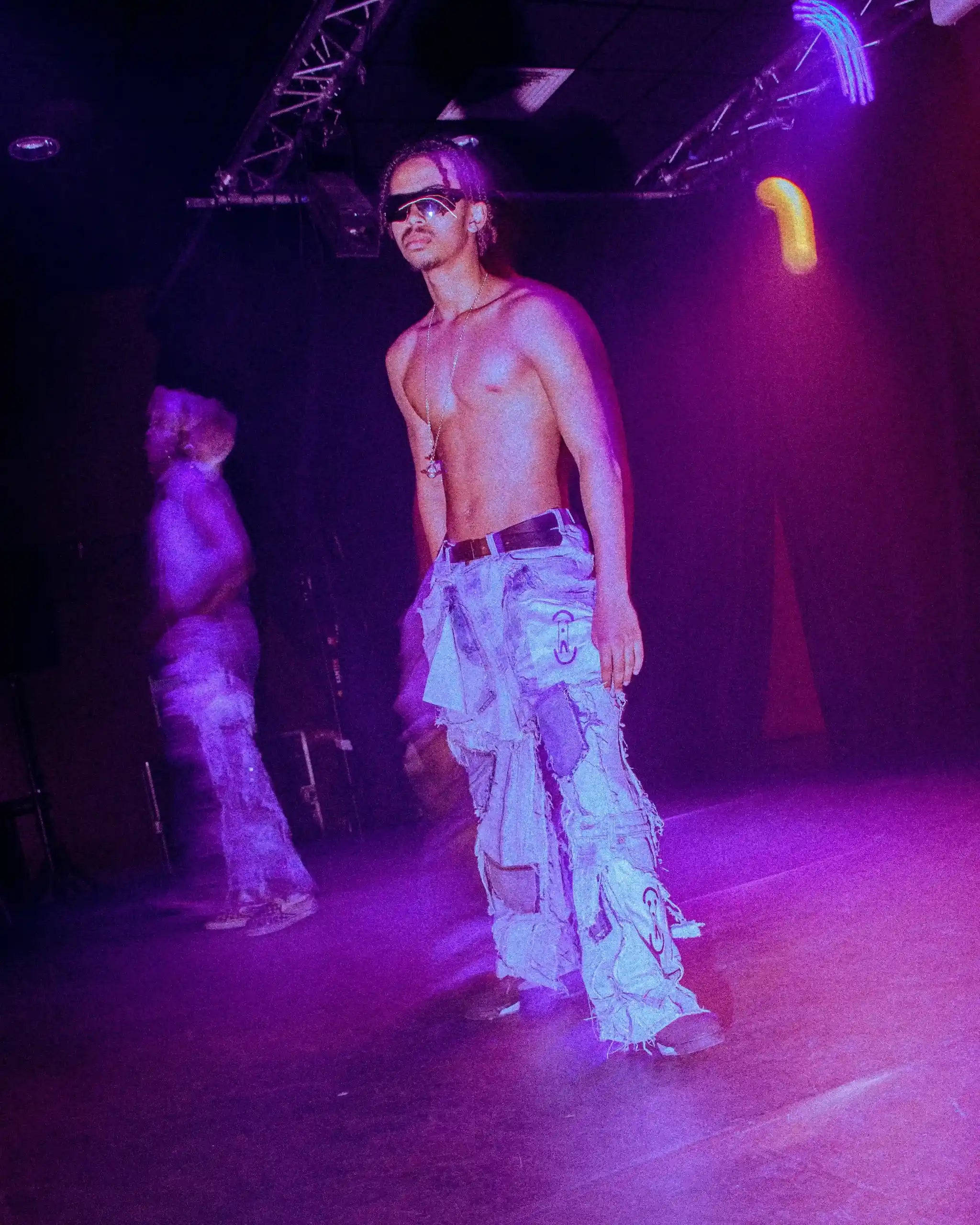 PrototypesParis fashion show: Patchwork Relic Denim in light-wash—handcrafted upcycled patches, front view.